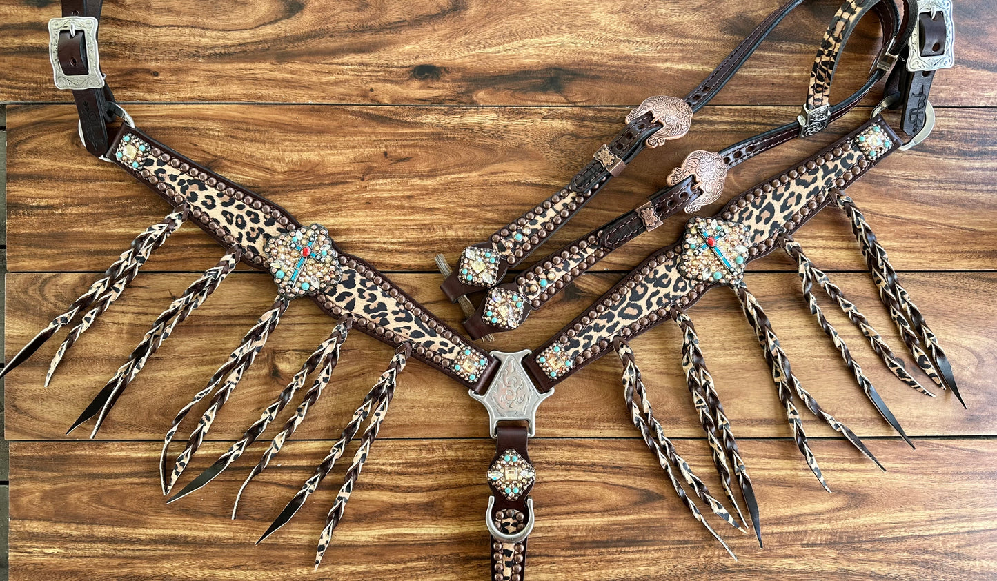 Tawny cheetah with fringe and cross conchos