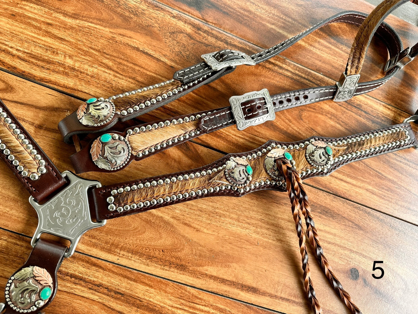 Cowhide with turquoise handmade conchos and twist fringe