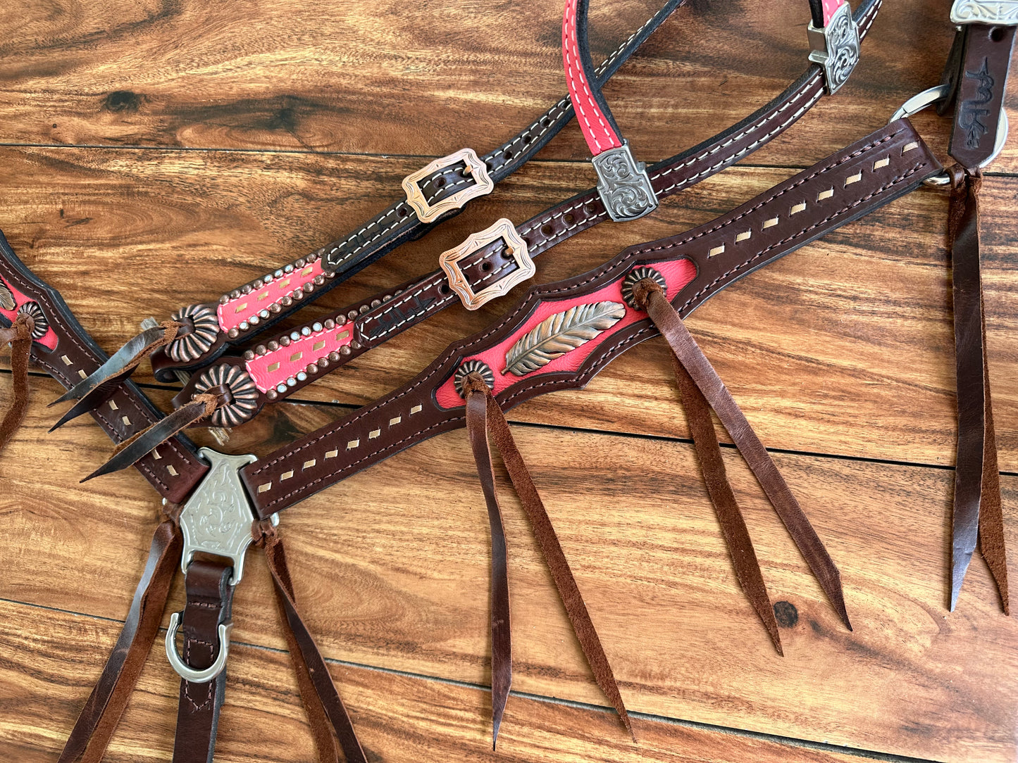 Coral with feather & pinwheel conchos