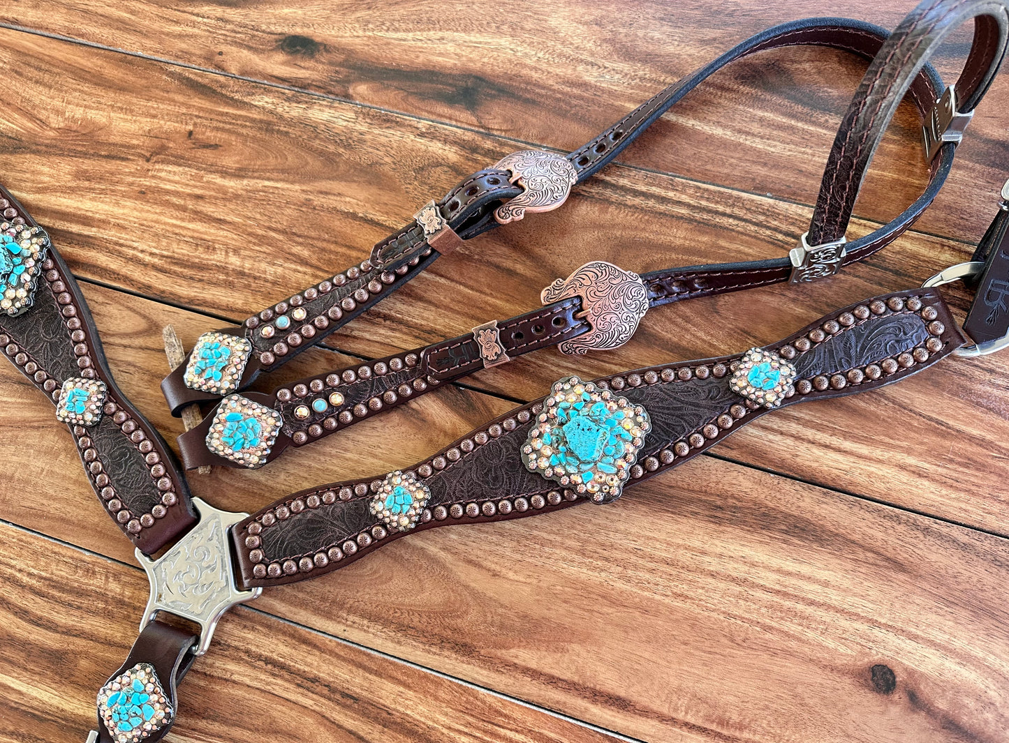 Brown tooled with turquoise rocks