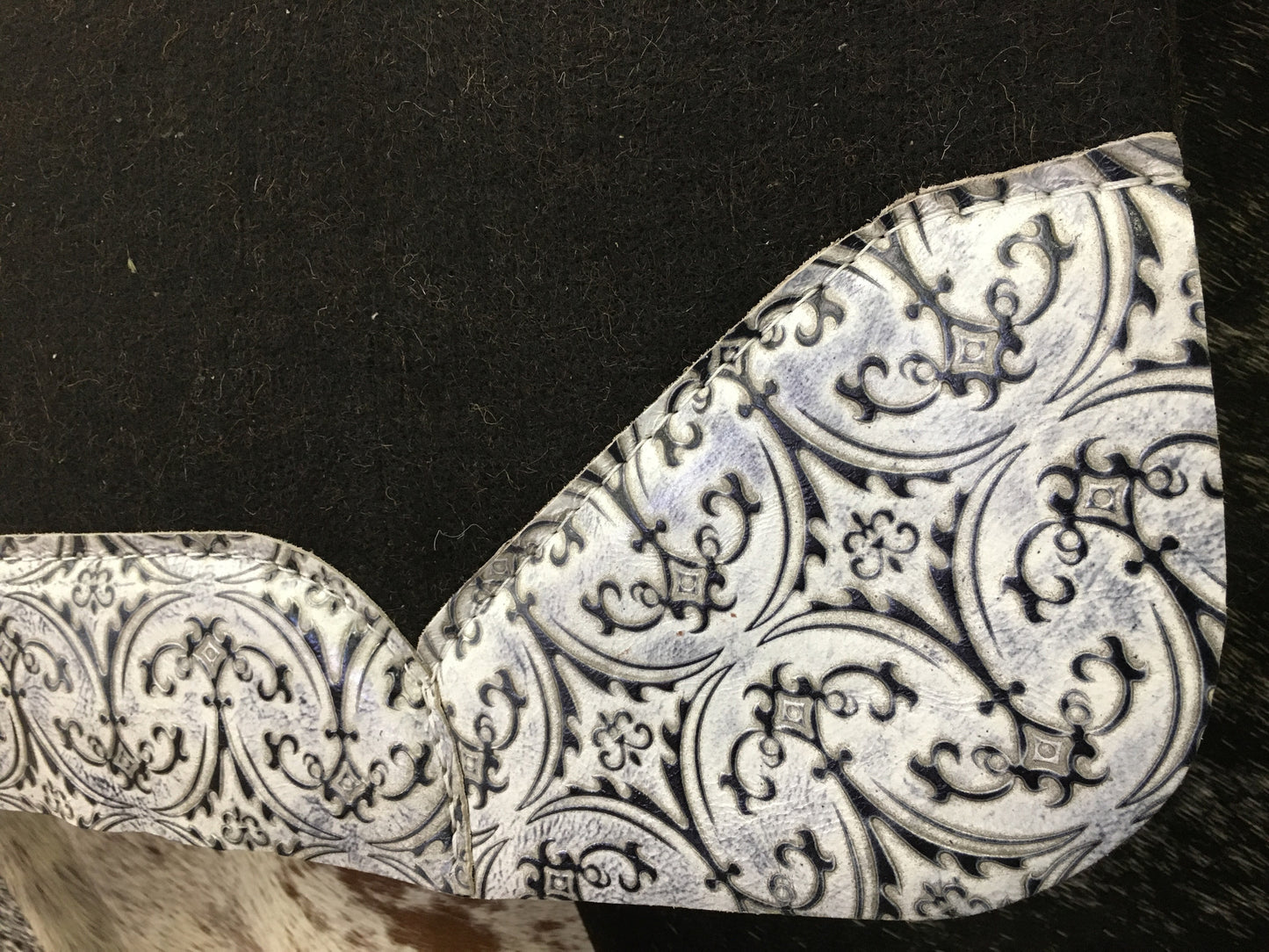 Best ever pad with white fleur de lis wear leathers
