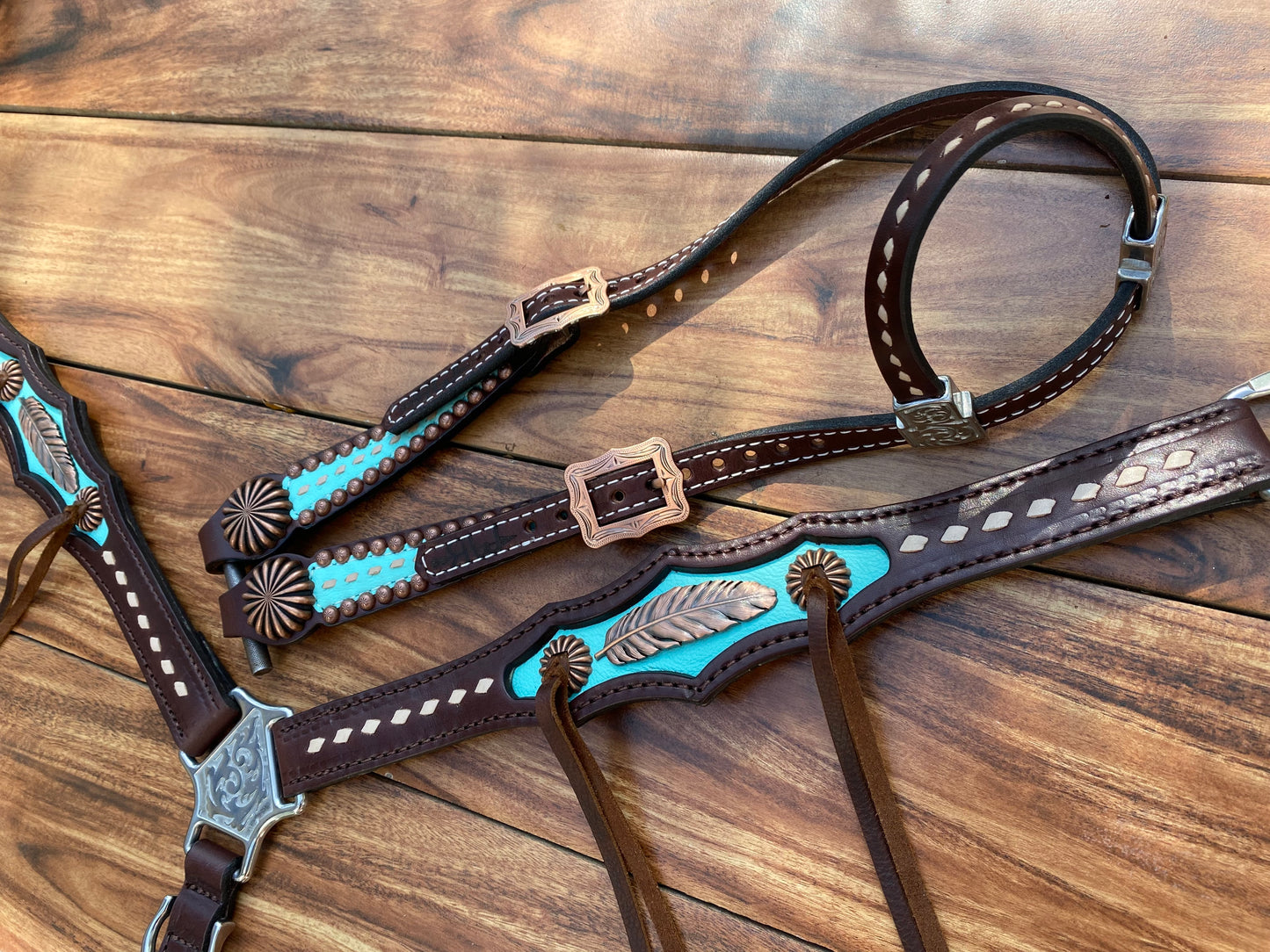 Turquoise with feather and pinwheel conchos