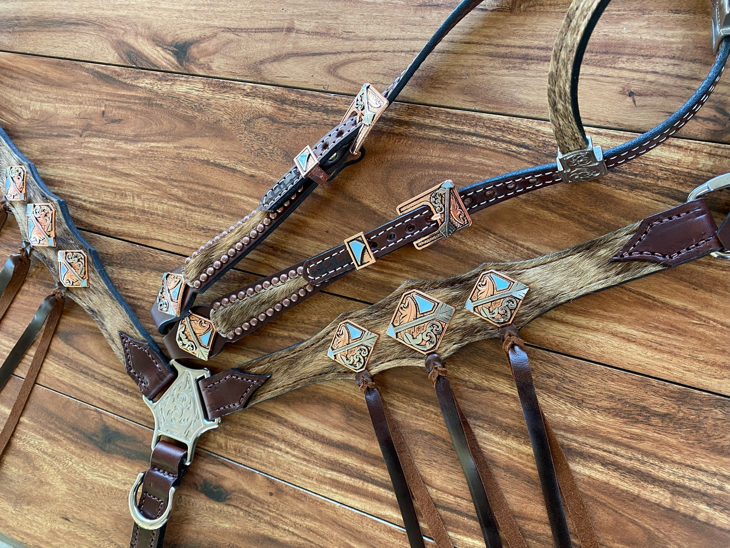 Cowhide with ties and arrow conchos