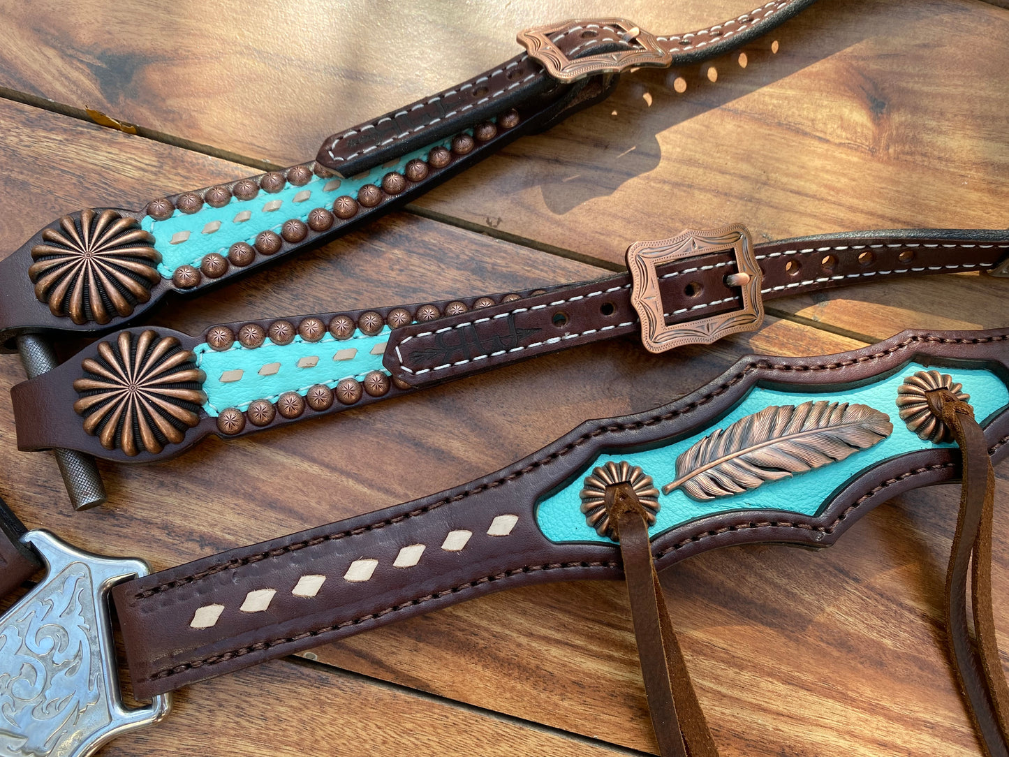 Turquoise with feather and pinwheel conchos