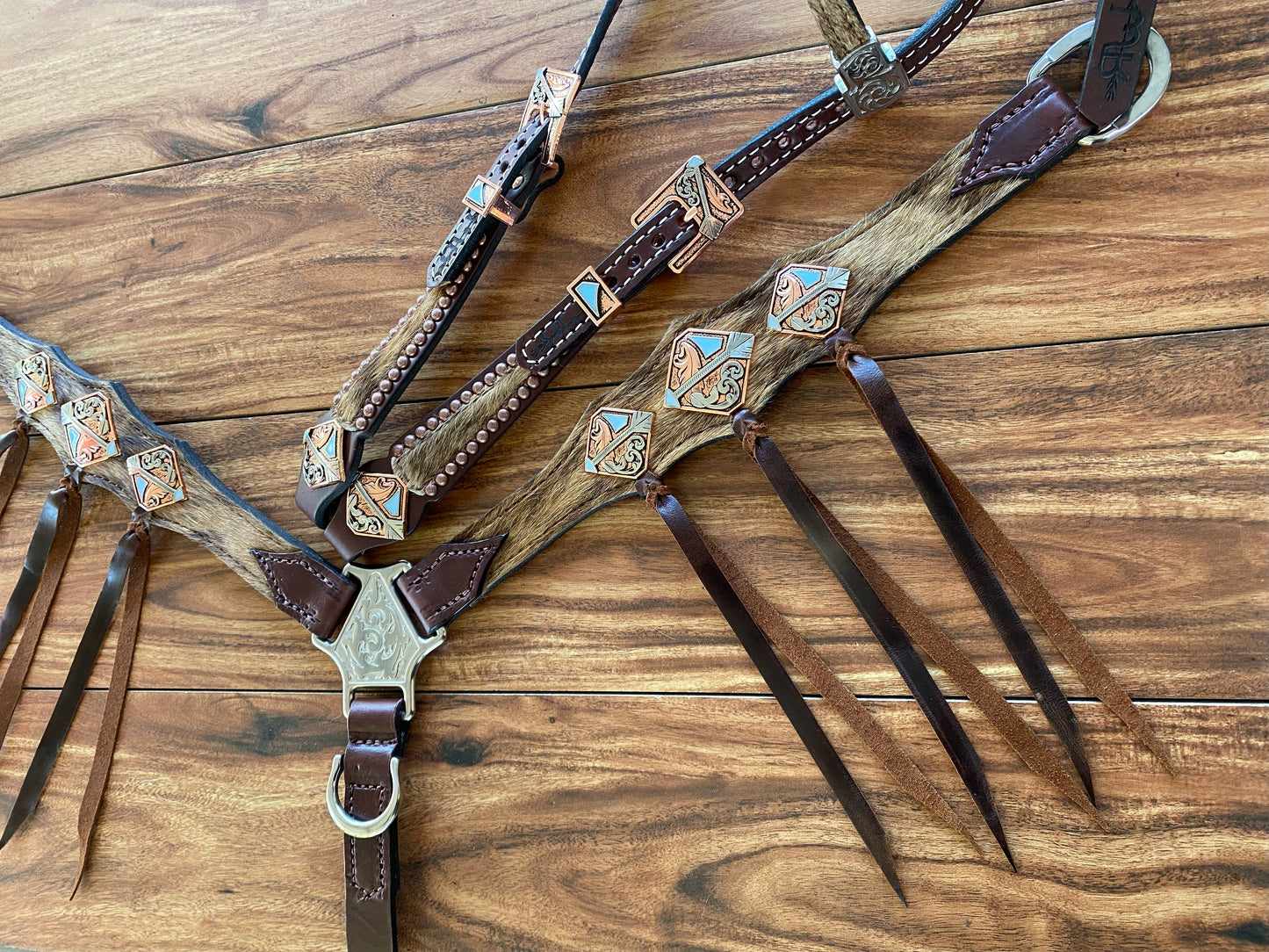Cowhide with ties and arrow conchos
