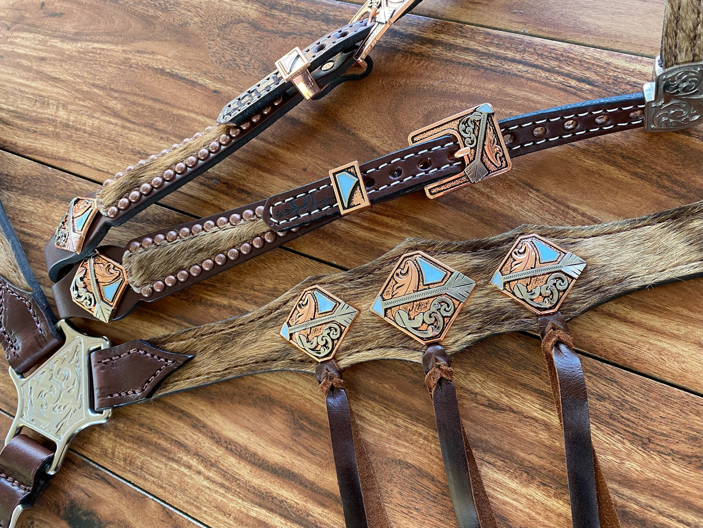 Cowhide with ties and arrow conchos