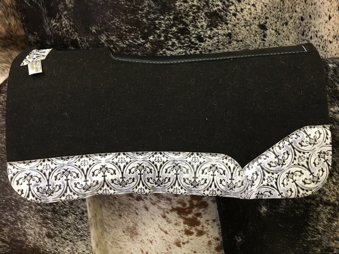 Best ever pad with white fleur de lis wear leathers