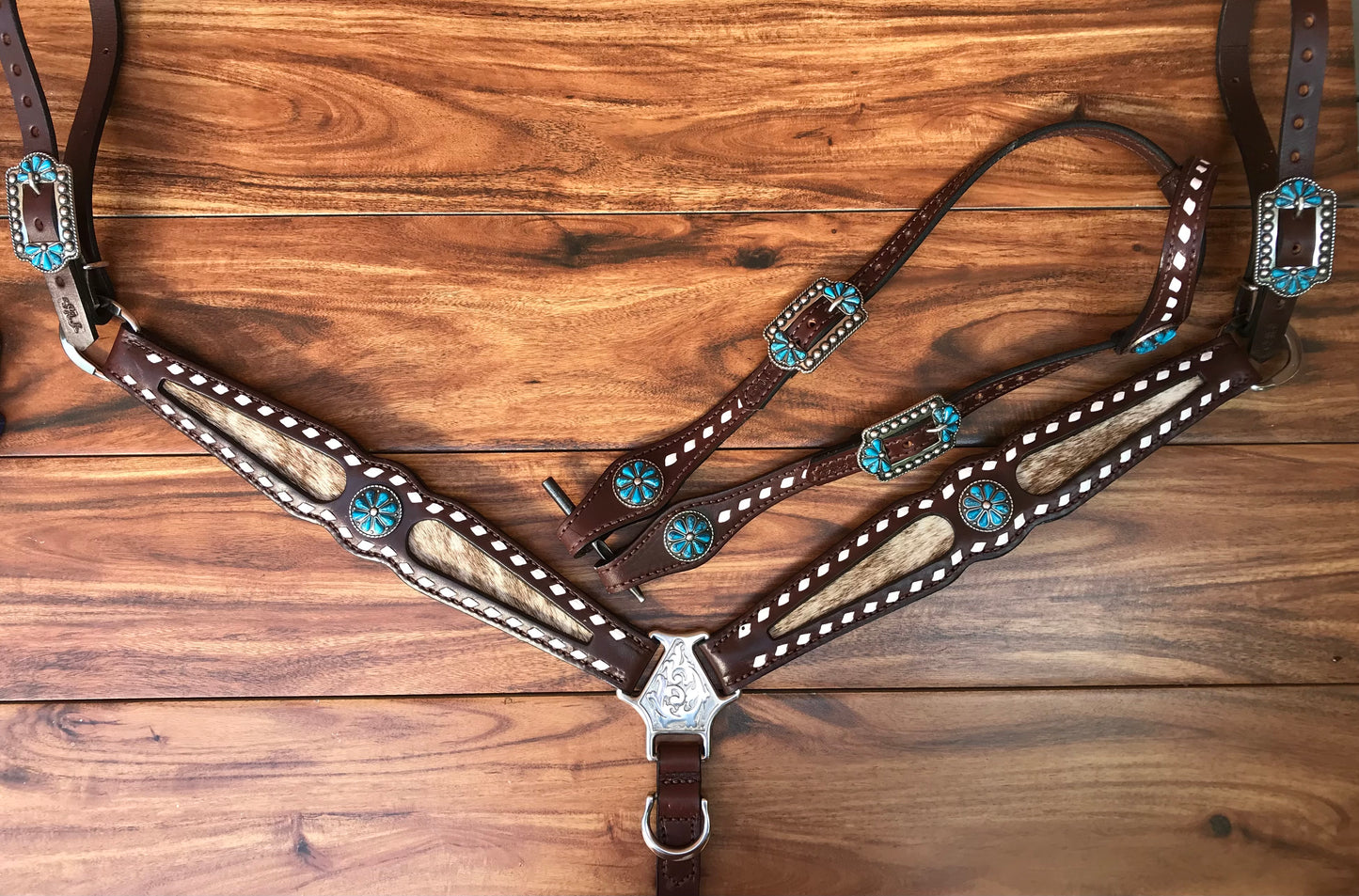 Buckstitch cowhide with turquoise flower