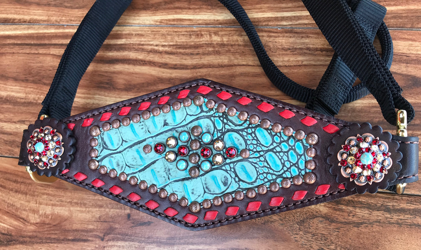 Turquoise gator with red buckstitch