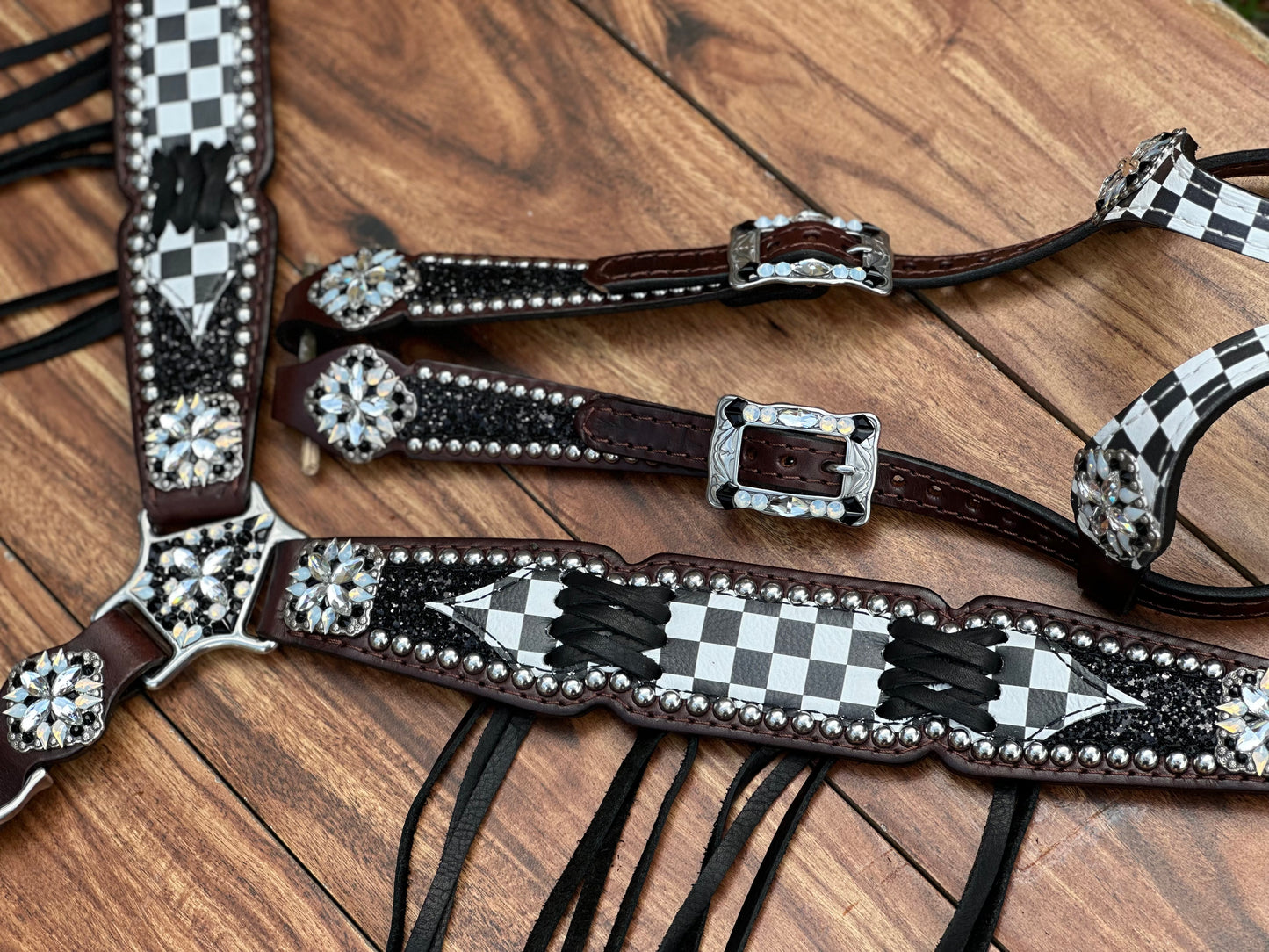 Checked with black chunky glitter. Cross stitch and fringe.