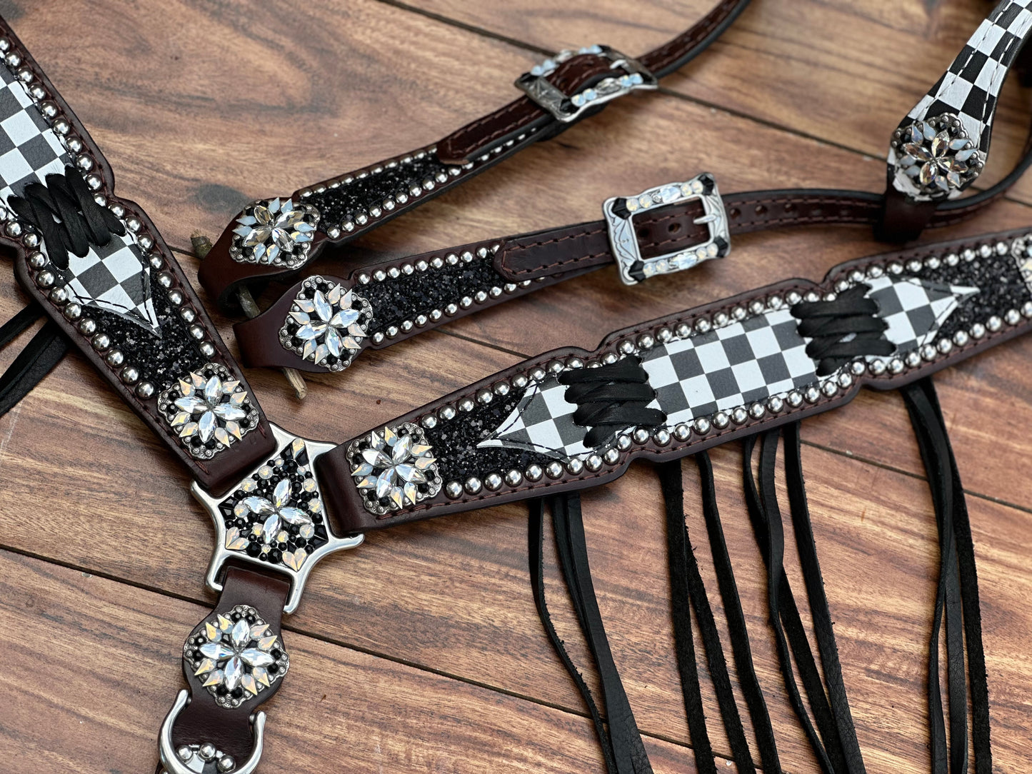 Checked with black chunky glitter. Cross stitch and fringe.