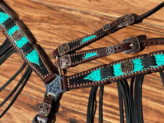 Turquoise with black chunky glitter and cross stitch with thunderbird conchos