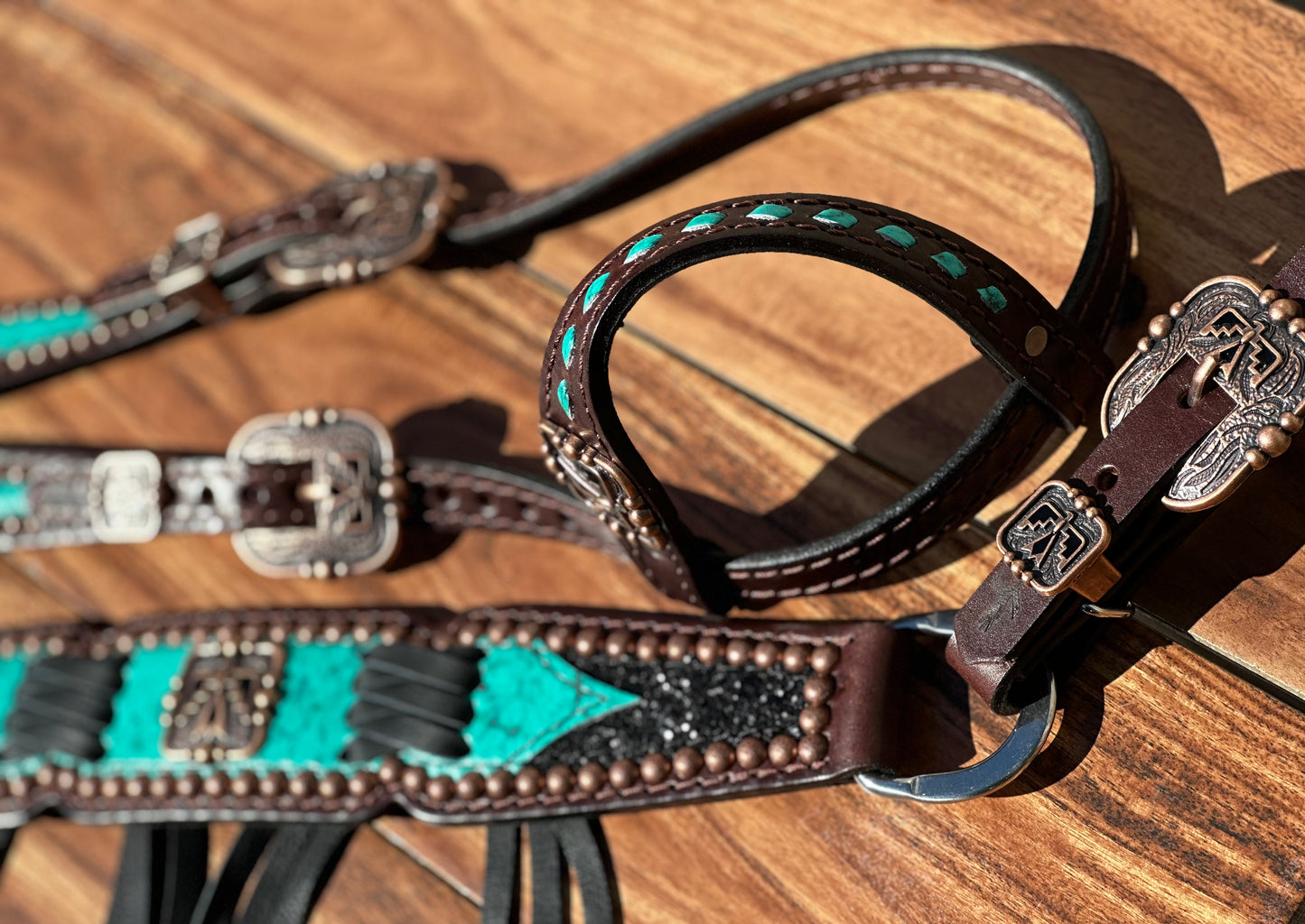 Turquoise with black chunky glitter and cross stitch with thunderbird conchos