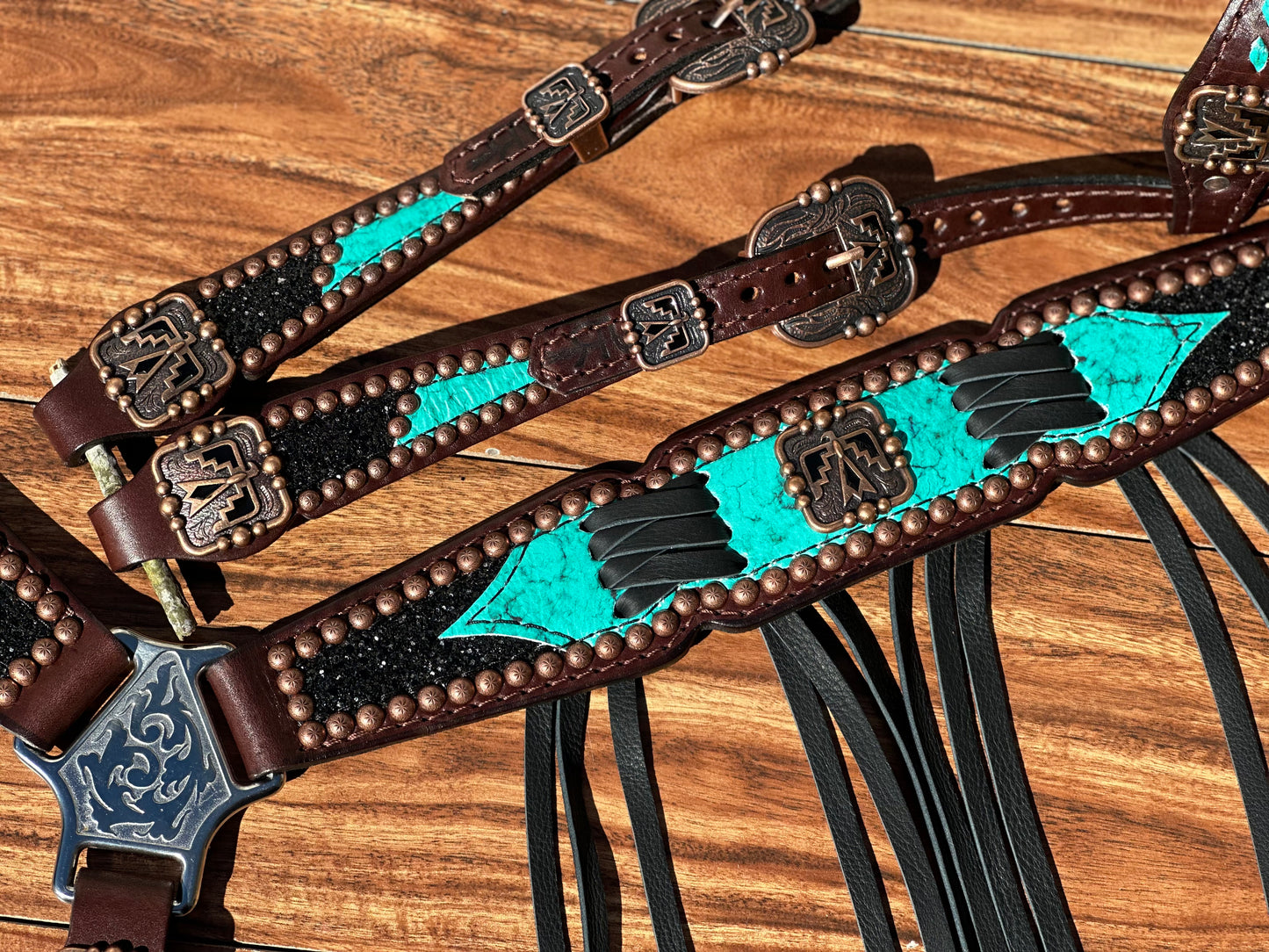 Turquoise with black chunky glitter and cross stitch with thunderbird conchos