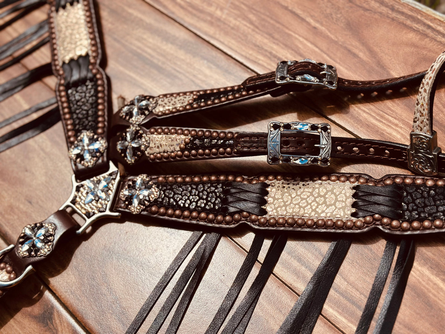 Black cheetah with rose gold cheetah and black cross stitch.