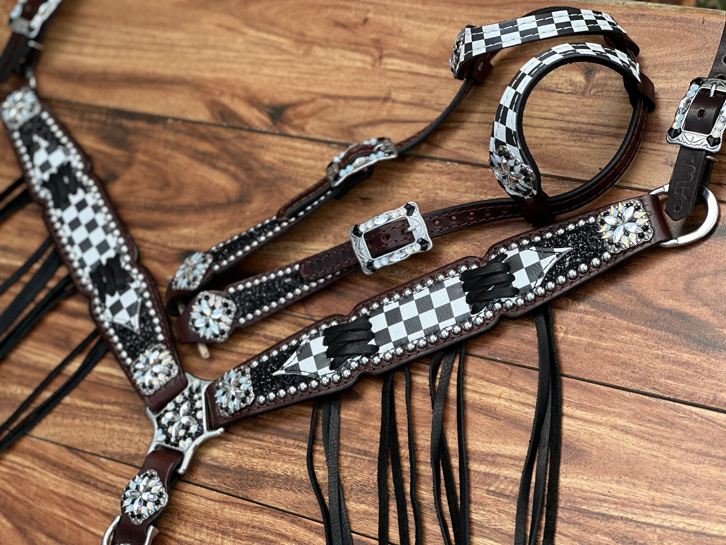 Checked with black chunky glitter. Cross stitch and fringe.