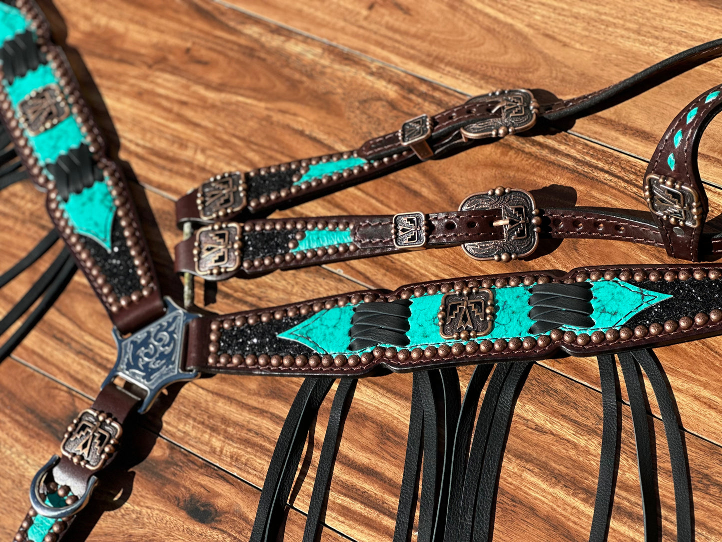 Turquoise with black chunky glitter and cross stitch with thunderbird conchos