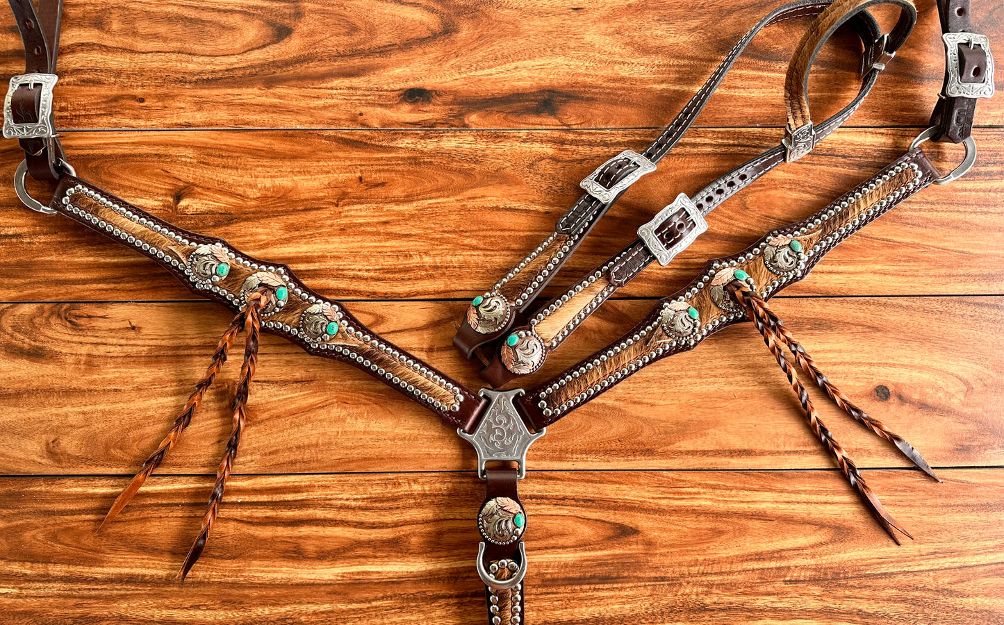 Cowhide with turquoise handmade conchos and twist fringe