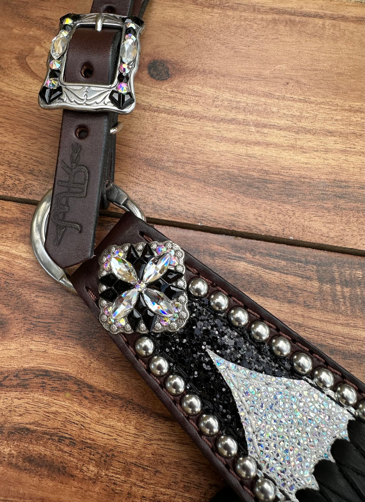 Ice over black chunky glitter. Cross stitch and fringe.