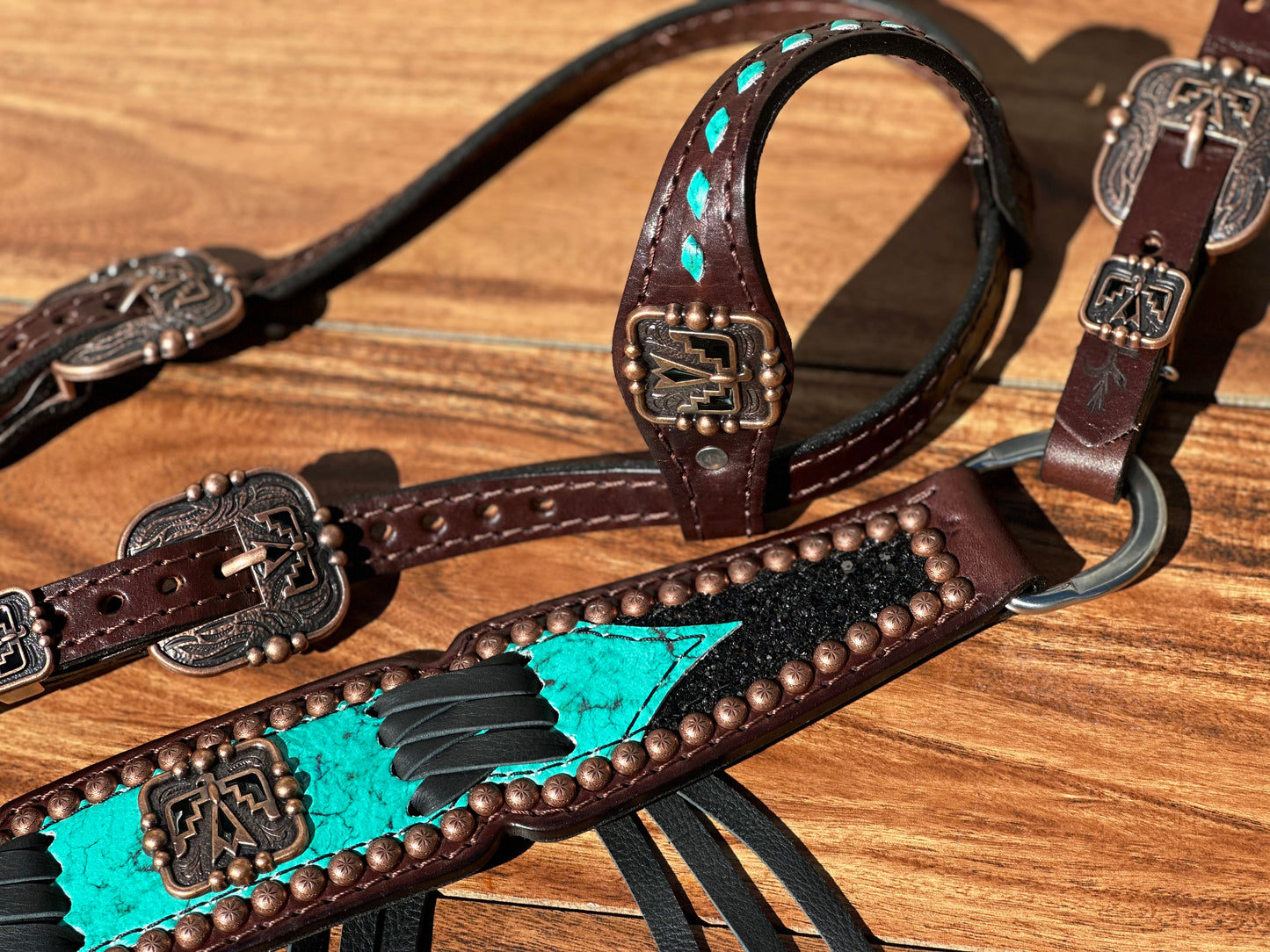 Turquoise with black chunky glitter and cross stitch with thunderbird conchos