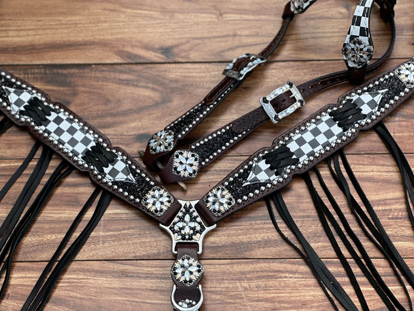 Checked with black chunky glitter. Cross stitch and fringe.