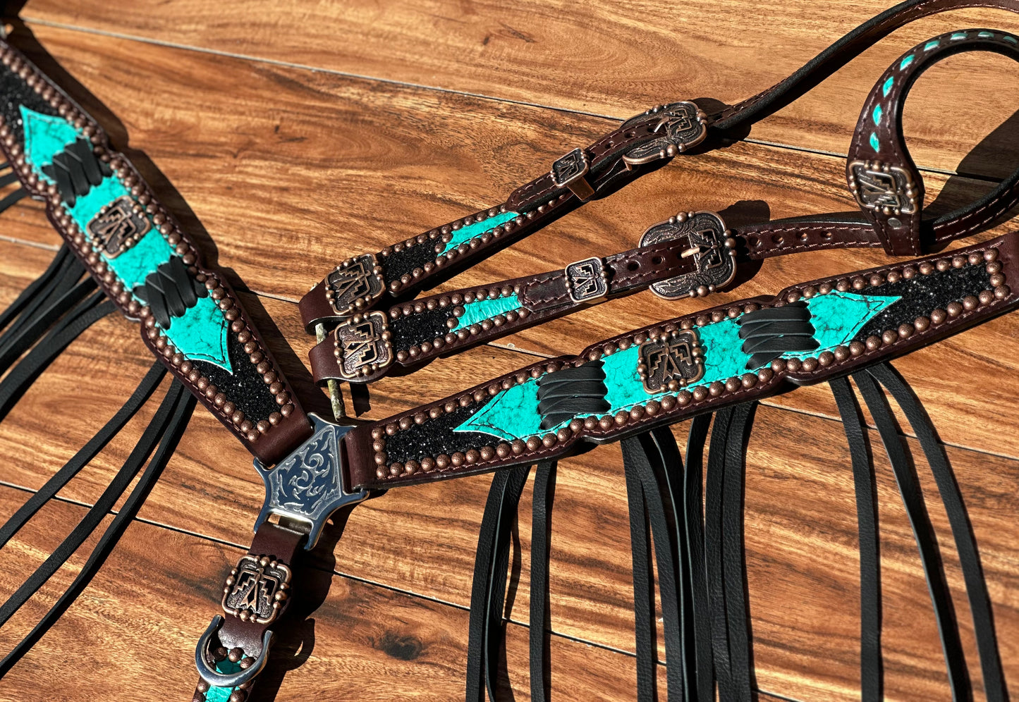 Turquoise with black chunky glitter and cross stitch with thunderbird conchos