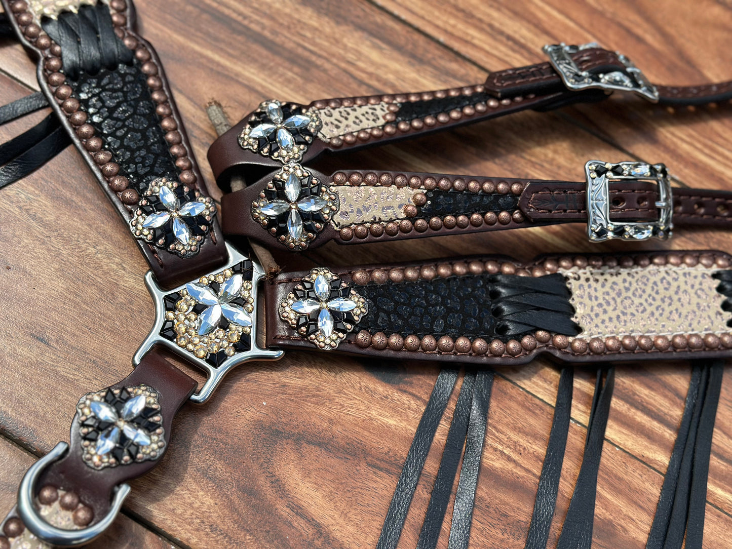 Black cheetah with rose gold cheetah and black cross stitch.