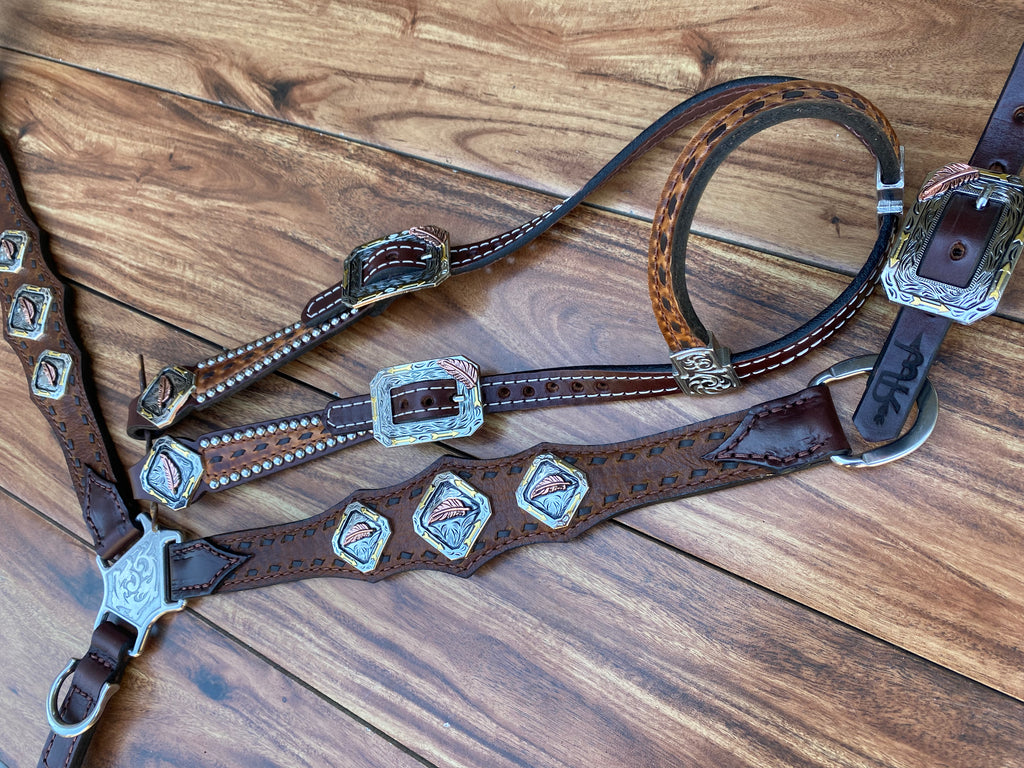 Brown buckstitch with feather conchos