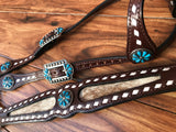 Buckstitch cowhide with turquoise flower