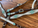 White gator with turquoise triangles