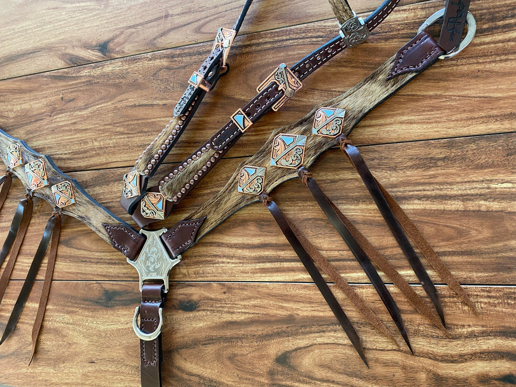 Cowhide with ties and arrow conchos