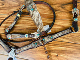 Cowhide with turquoise handmade conchos and twist fringe