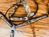Cowhide with turquoise handmade conchos and twist fringe