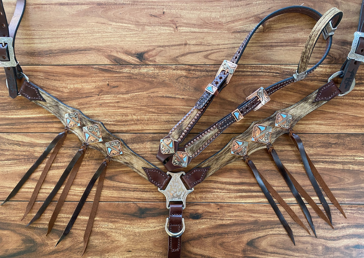 Cowhide with ties and arrow conchos